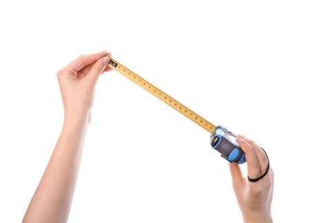 Female hands with measuring tape on white background