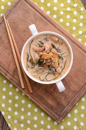 Pot with tasty seaweed soup on tableの写真素材