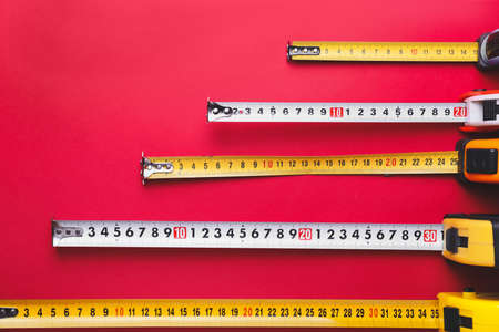 Measuring tapes on color backgroundの写真素材