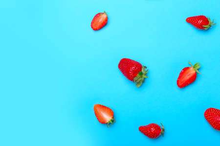 Sweet ripe strawberry on color backgroundの写真素材