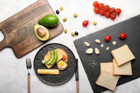 Tasty avocado sandwiches on light backgroundの写真素材