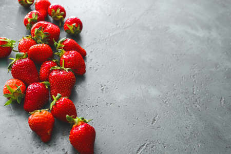 Sweet ripe strawberry on gray backgroundの写真素材