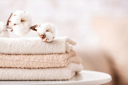 Cotton towels on table in bathroomの写真素材