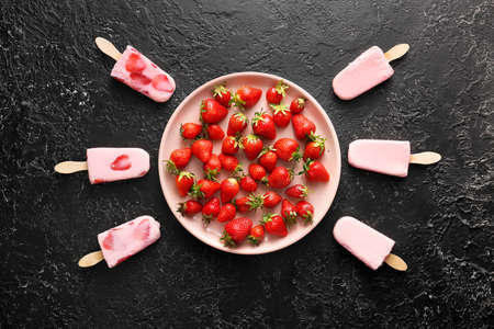 Tasty strawberry ice cream on dark backgroundの写真素材