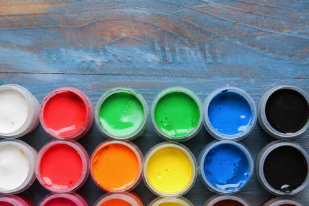 Bottles of gouache paints on tableの写真素材