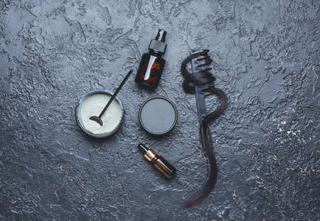Set for hair treatment on dark background