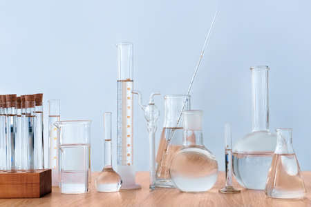 Different glassware on table in laboratoryの写真素材