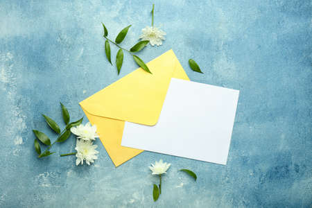 Composition with blank card and envelope on color backgroundの写真素材