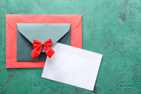 Blank card and envelopes on color background