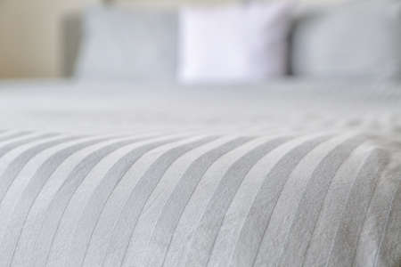 Clean sheet on bed, closeupの写真素材