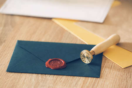 Envelope with notary public wax seal on table