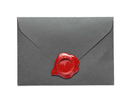 Envelope with wax seal stamp on white backgroundの写真素材