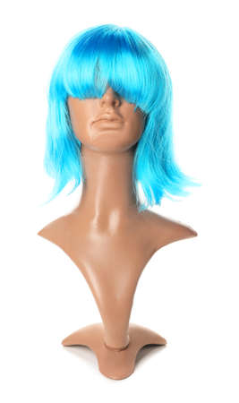 Mannequin with bright female wig on white backgroundの写真素材