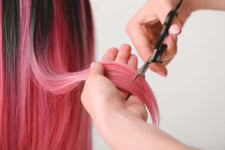 Hairdresser working with client in salon, closeupの写真素材
