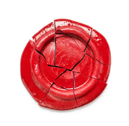 Broken wax seal stamp on white backgroundの写真素材