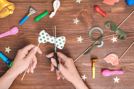 Woman making party decor at tableの写真素材