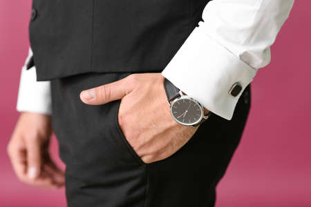 Young man in formal clothes on color background, closeup
