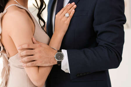 Young couple wearing stylish accessories indoorsの写真素材