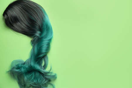 Unusual wig on color background