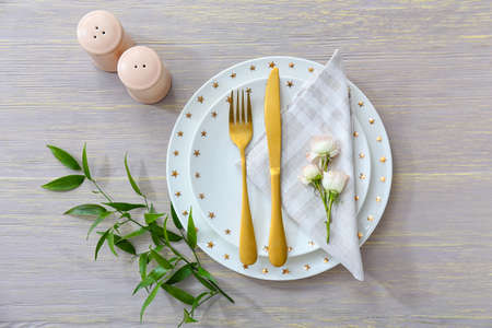 Beautiful table setting on wooden backgroundの写真素材