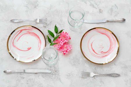 Beautiful table setting on light backgroundの写真素材