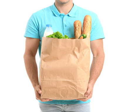 Delivery man with food in bag on white backgroundの写真素材
