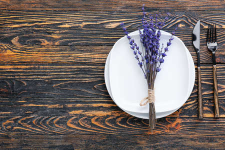 Beautiful table setting on wooden backgroundの写真素材