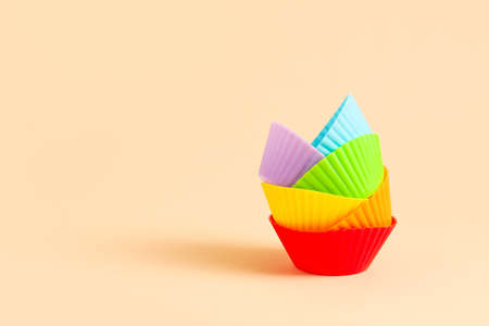Muffin baking cups on color backgroundの写真素材