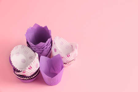 Muffin baking cups on color backgroundの写真素材