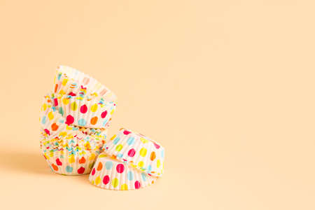 Muffin baking cups on color backgroundの写真素材