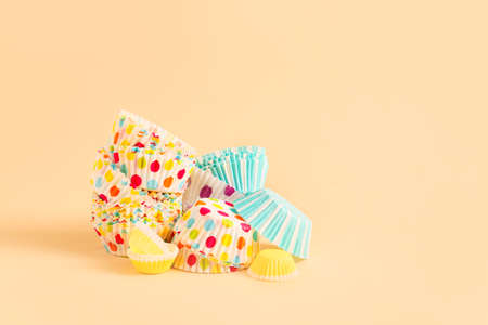 Muffin baking cups on color backgroundの写真素材