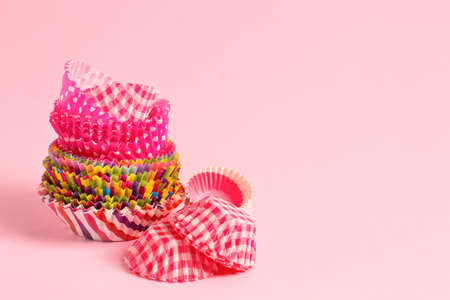 Muffin baking cups on color backgroundの写真素材