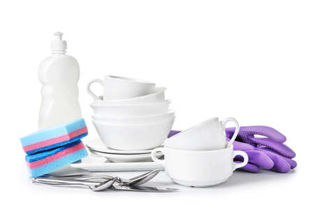 Clean tableware with sponges, detergent and gloves on white backgroundの写真素材
