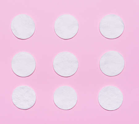Cotton cosmetic pads on color backgroundの写真素材