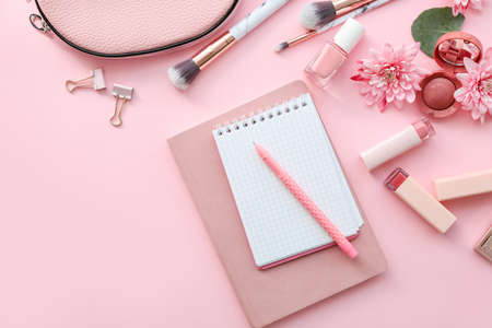 Different stationery with makeup cosmetics on color backgroundの写真素材