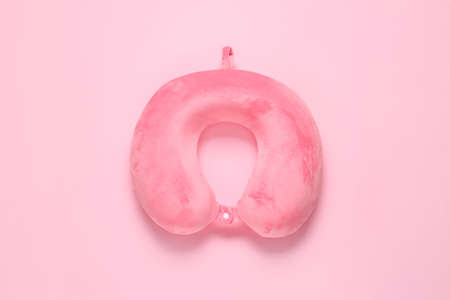 Travel pillow on color background