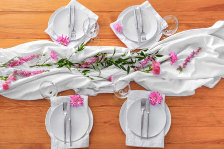 Beautiful table setting on wooden backgroundの写真素材