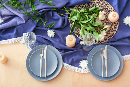 Beautiful table setting on wooden backgroundの写真素材