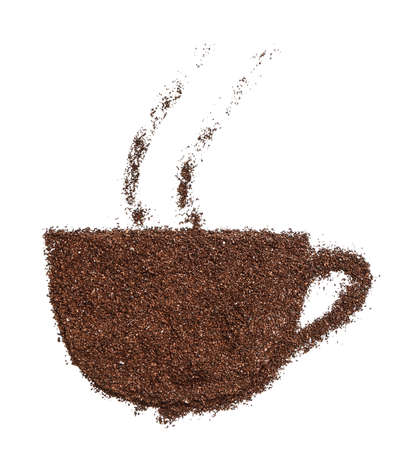 Cup shape made of coffee powder on white backgroundの写真素材