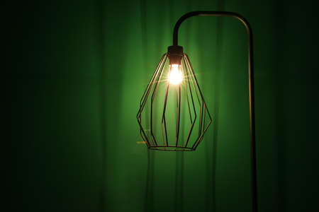 Glowing lamp on dark backgroundの写真素材
