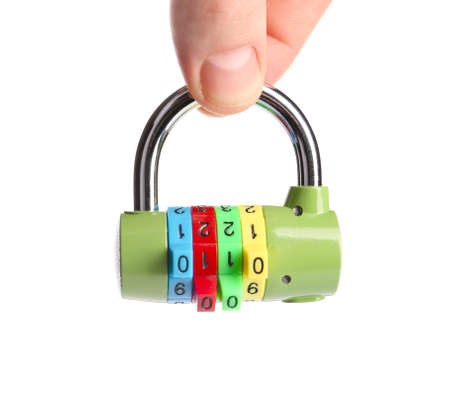 Male hand with small lock on white backgroundの写真素材