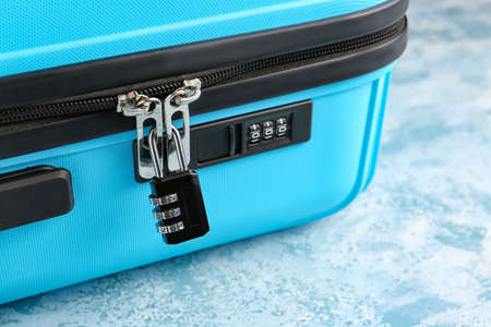 Suitcase with lock on color background, closeupの写真素材