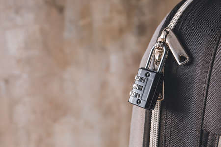 Suitcase with lock on gray background, closeupの写真素材