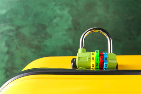 Suitcase with lock on color background, closeupの写真素材