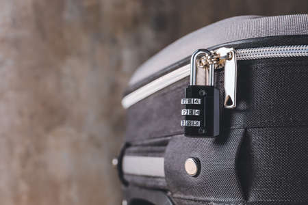 Suitcase with lock on gray background, closeupの写真素材