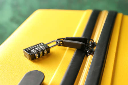 Suitcase with lock on color background, closeupの写真素材