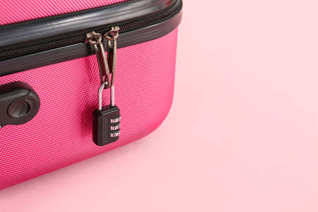 Suitcase with lock on color background, closeupの写真素材