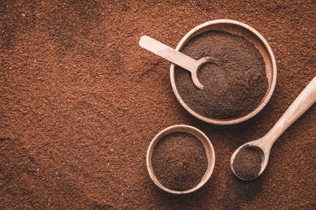 Bowls and spoons on coffee powderの写真素材
