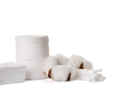 Cotton cosmetic pads and swabs on white backgroundの写真素材