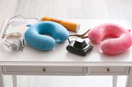 Traveler items on table in roomの写真素材